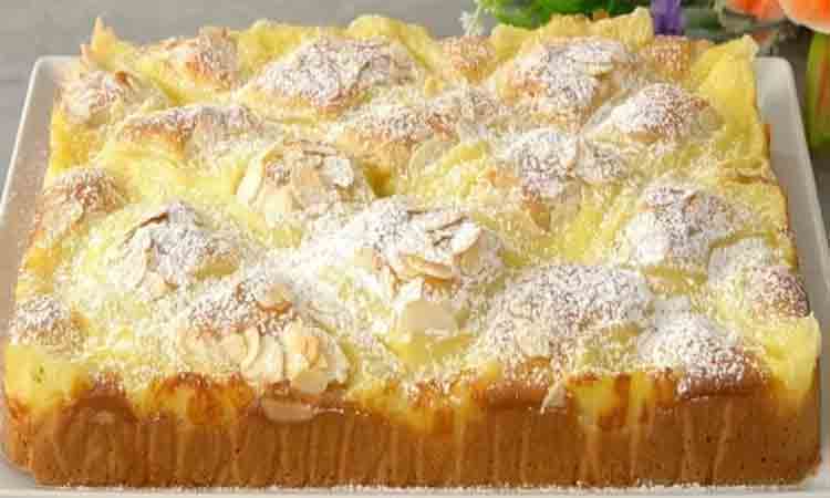 Descoperă rețeta noastră delicioasă de pandișpan pufos, umplut cu cremă de vanilie și decorat cu fulgi de migdale