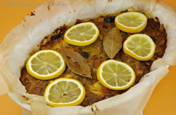 Lamm-Bobotie en roumain se traduit par :  
Bobotie cu miel